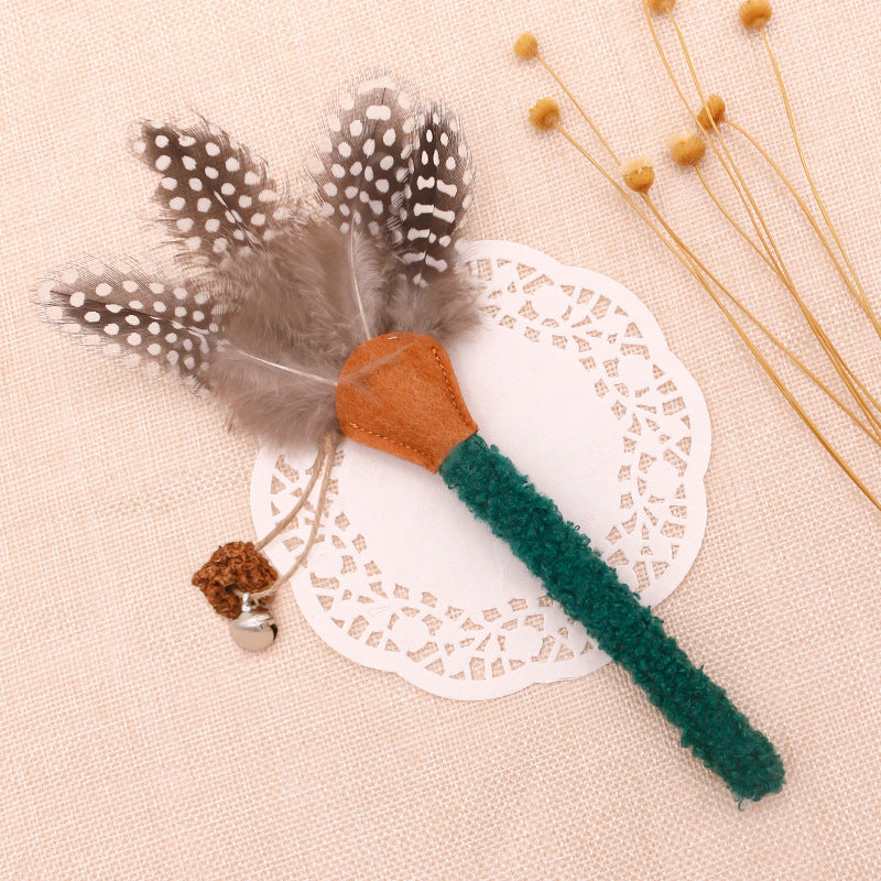 Green silvervine cat chew stick with feather and bell