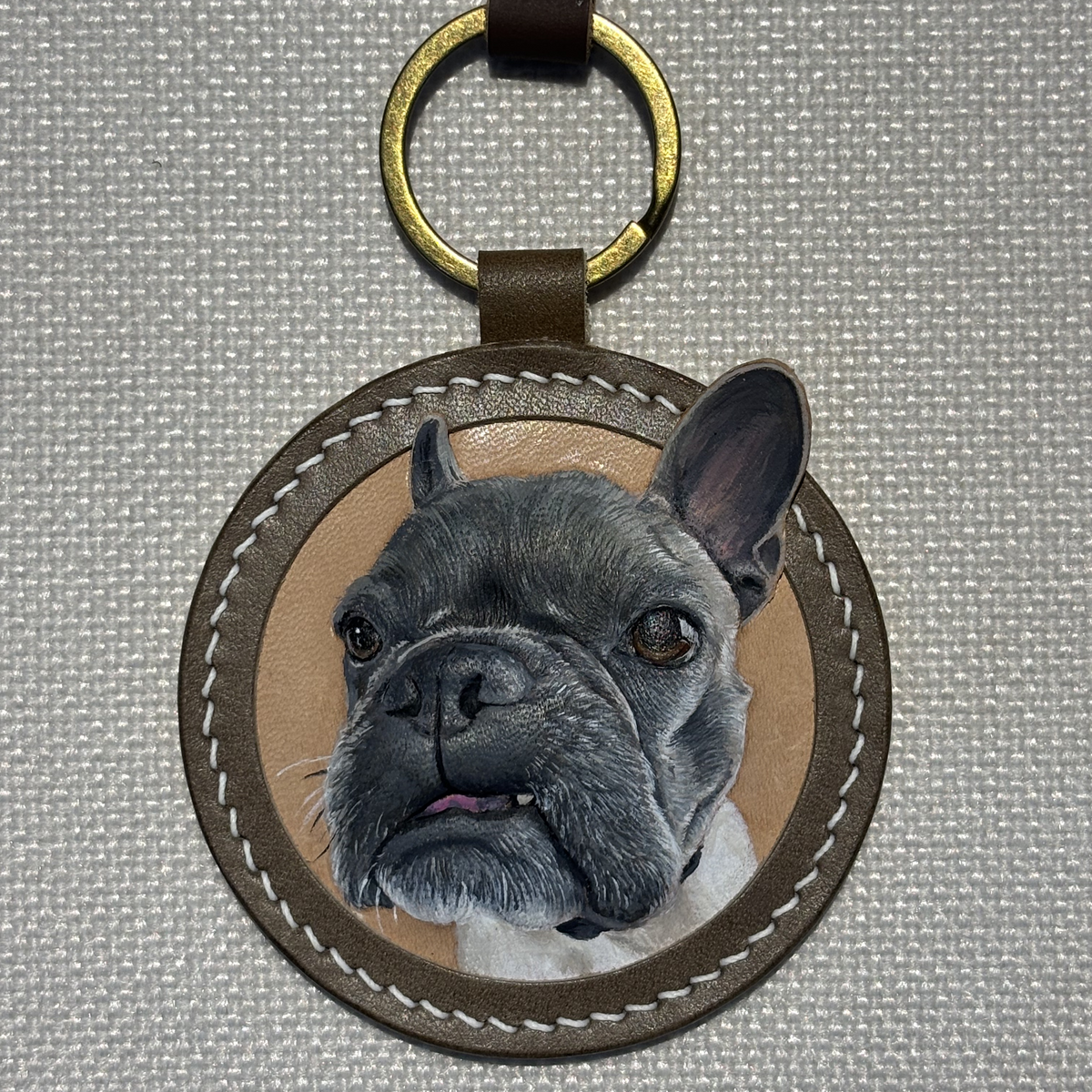 Custom French bulldog leather keychain product close-up