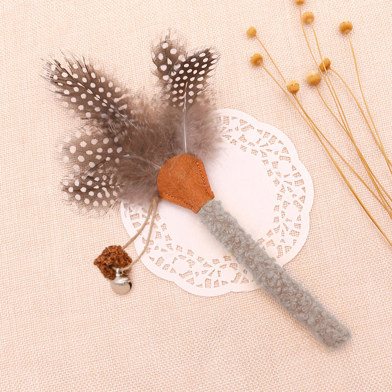 Grey silvervine cat chew stick with feather and bell